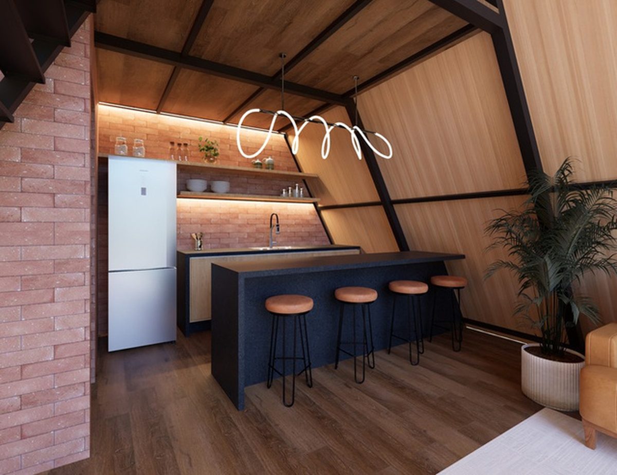 Cozinha completa do chalé com ilha, bancada e banquetas